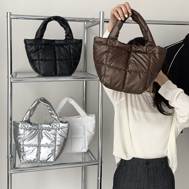 Korean version of trendy down bag women's niche design autumn and winter simple high-end handbag hand carry cotton clothing bag