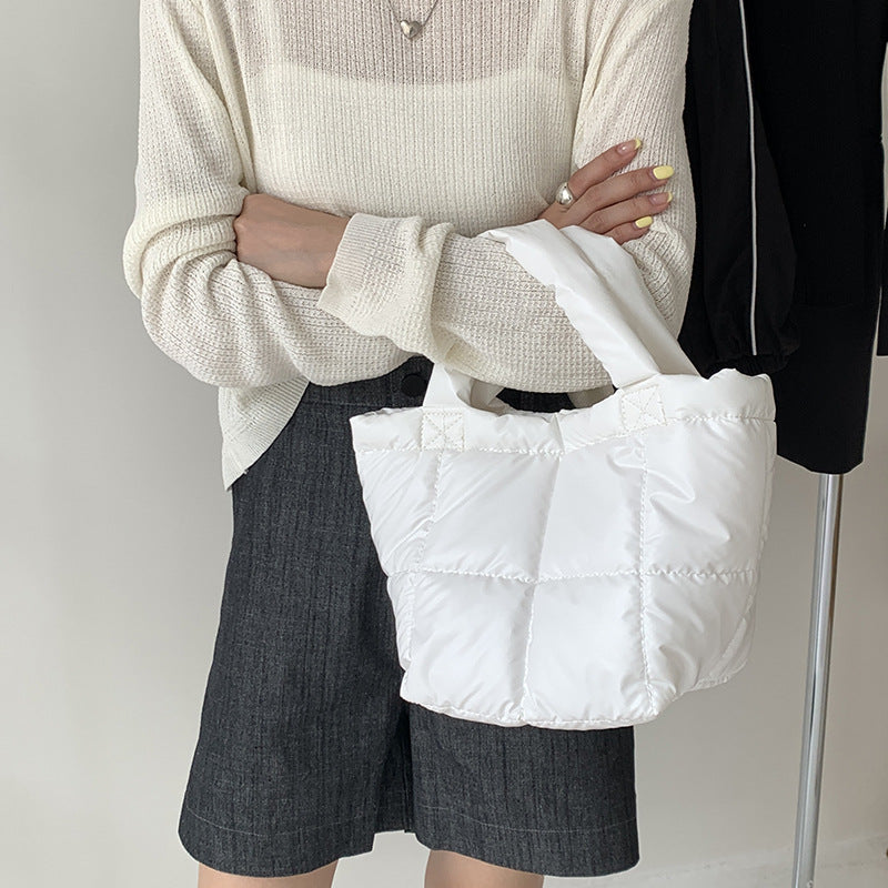 Korean version of trendy down bag women's niche design autumn and winter simple high-end handbag hand carry cotton clothing bag