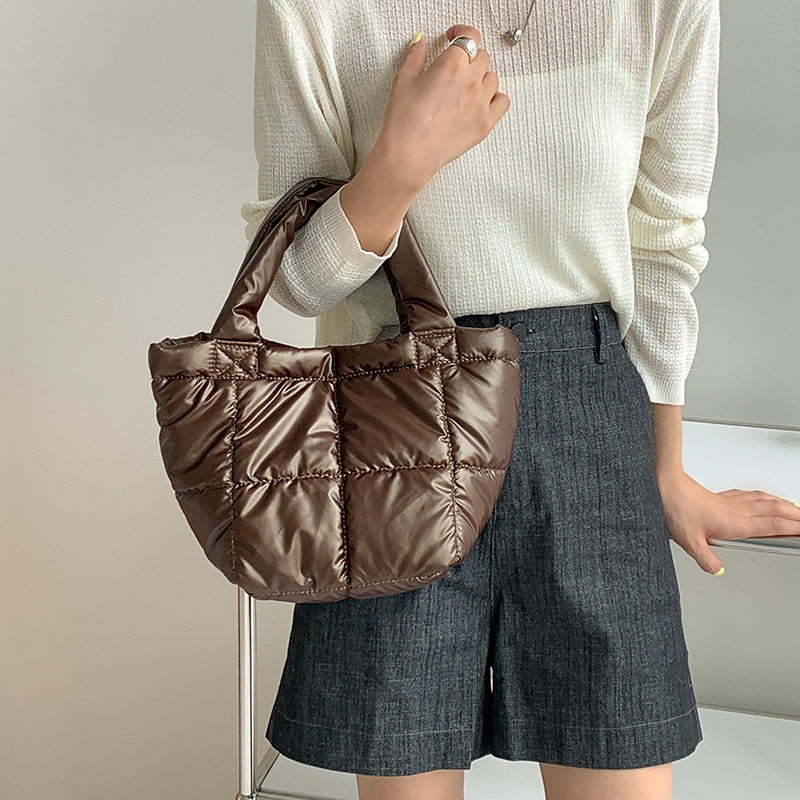 Korean version of trendy down bag women's niche design autumn and winter simple high-end handbag hand carry cotton clothing bag