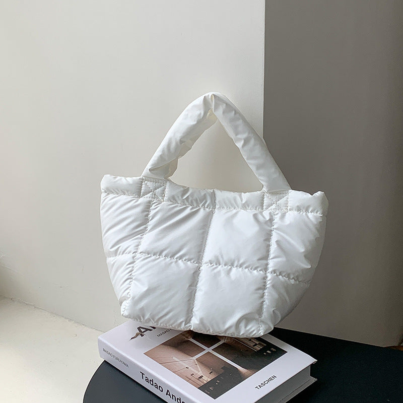 Korean version of trendy down bag women's niche design autumn and winter simple high-end handbag hand carry cotton clothing bag