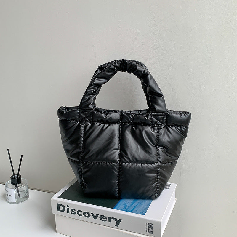 Korean version of trendy down bag women's niche design autumn and winter simple high-end handbag hand carry cotton clothing bag